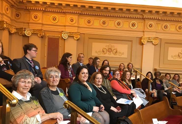 Group of people sitting in the gallery of the Virginia General Assembly Senate waiting be recognized by state Senators.