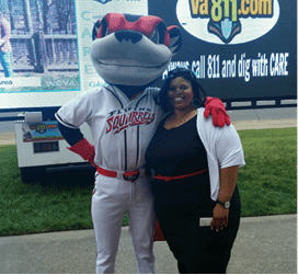 Photo of Quan Williams of the Action Alliance with the Richmond Flying Squirrels mascot.