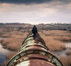 Person walking on a pipeline