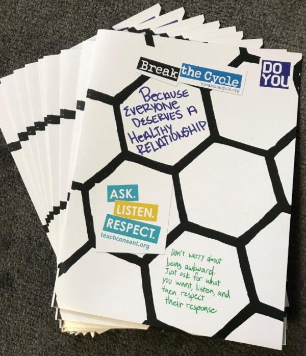 A stack of folders fanned out. The folders have a white hexagonal pattern with black outlines. In the upper right hand corner is the DO YOU logo with a blue square background and DO YOU in white letters.